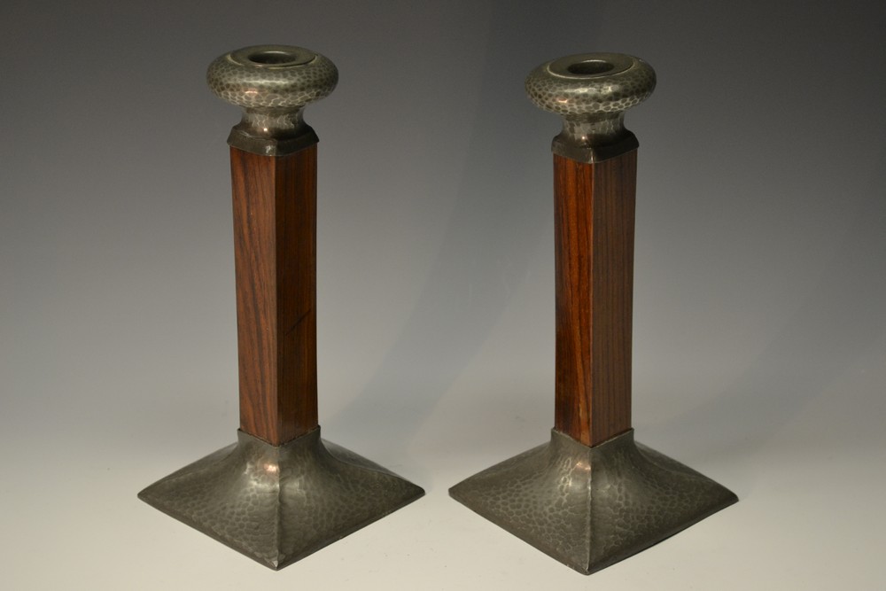 A pair of Art Deco pewter mounted rosewood table candlesticks, of angular form, 23cm,