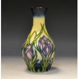 A contemporary Moorcroft Crocus pattern vase, designed by Rachel Bishop, with stylised crocuses,