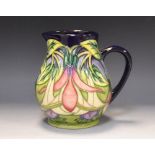 A contemporary Moorcroft Fuschia pattern jug, designed by Philip Gibson,