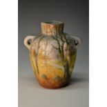 A Delphin Massier, Vallauris two handled vase, hand painted with path through autumnal woodland,