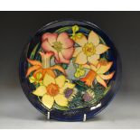 A contemporary Moorcroft Golden Jubilee 2002 circular plate,