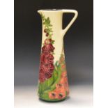 A cotemporary Moorcroft Amberwood pattern slender jug, designed by Rachel Bishop,