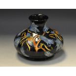 A contemporary Moorcroft Carillion Blue pattern compressed ovoid vase, designed by Sian Leeper,