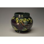 A contemporary Moorcroft Finches pattern compressed ovoid vase,