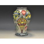 A contemporary Moorcroft Balloons pattern baluster vases,