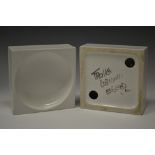 A Troika cubist ashtray, by Anne Lewis, dished concave centre, glazed throughout in white,