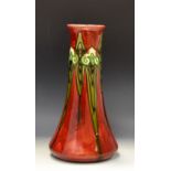 A Mintons Secessionist flared cylindrical vase, tube lined with scrolls and tendrils,