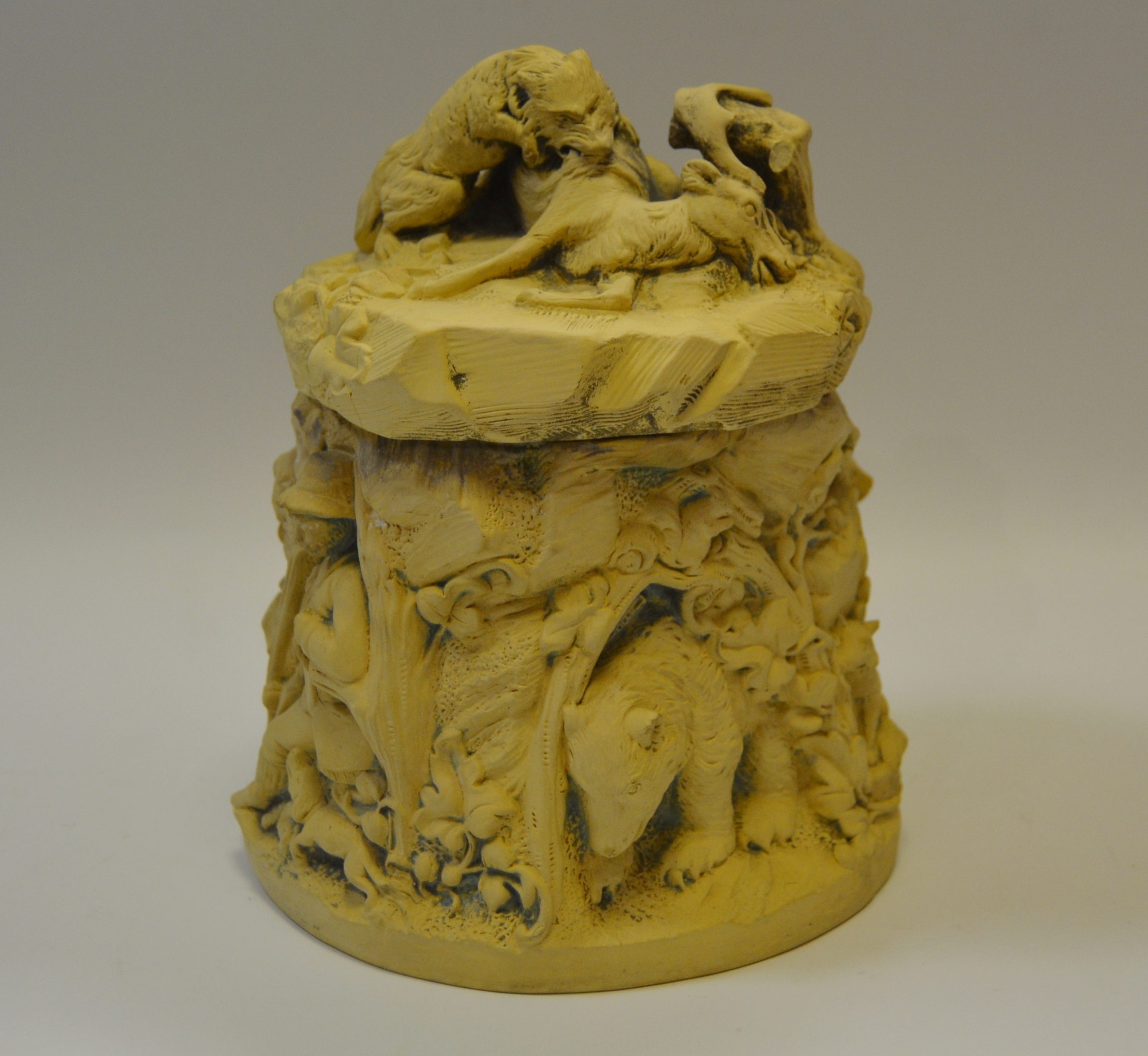 A French biscuit porcelain tobacco jar and cover , moulded with a Wild Boar hunt scene c.