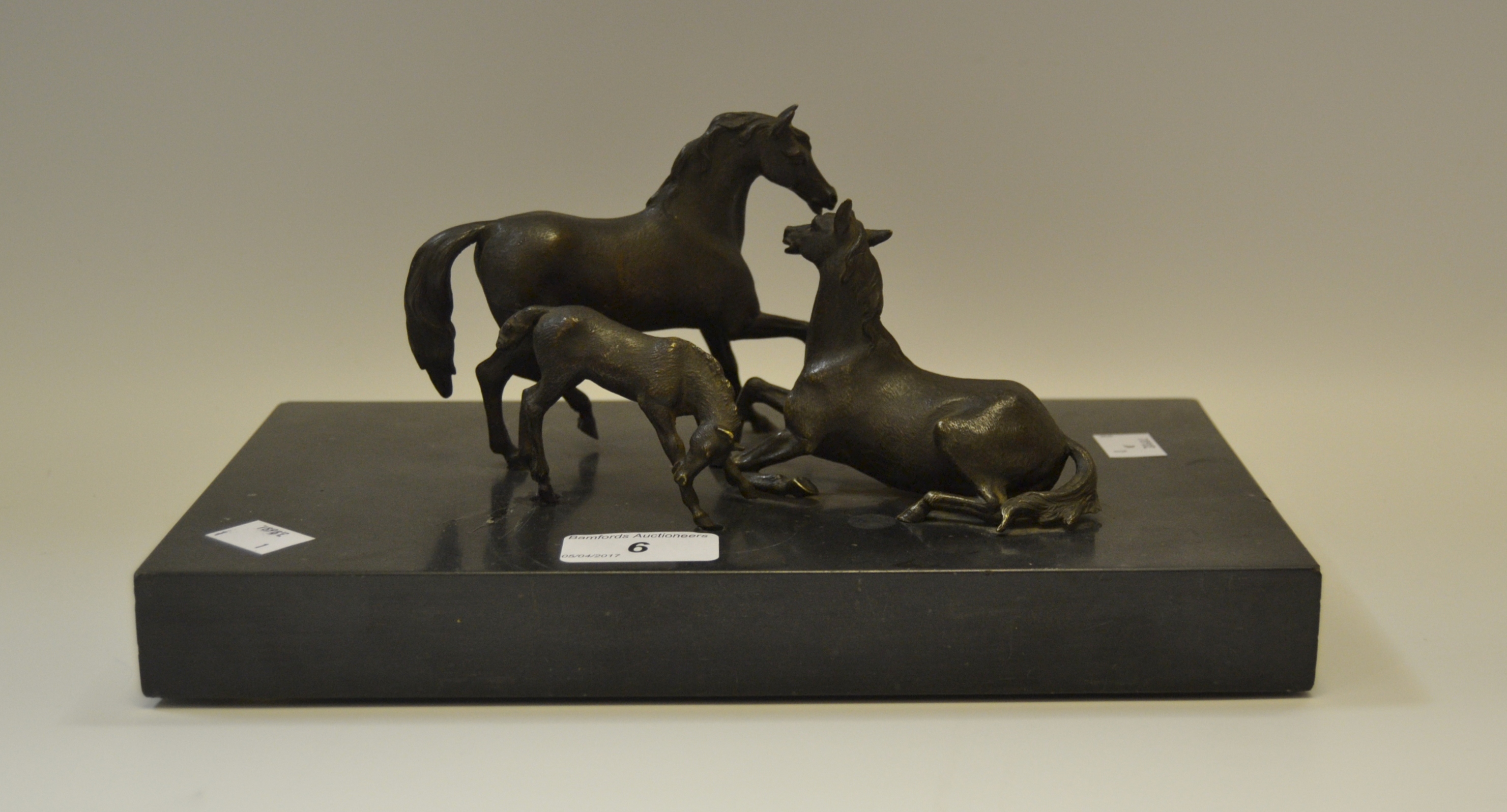A Continental bronze group of horses mounted on a plinth,