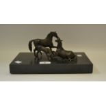 A Continental bronze group of horses mounted on a plinth,