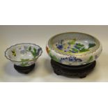 A cloissone enamel circular bowl, decorated with flowers and birds, white ground, wooden stand,