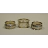 A pair of George V silver napkin rings, Chester 1914; another, Chester 1899,