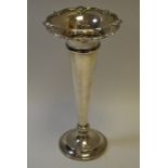 A silver slender shaped vase, standing 27cm tall marked Sheffield 1925,