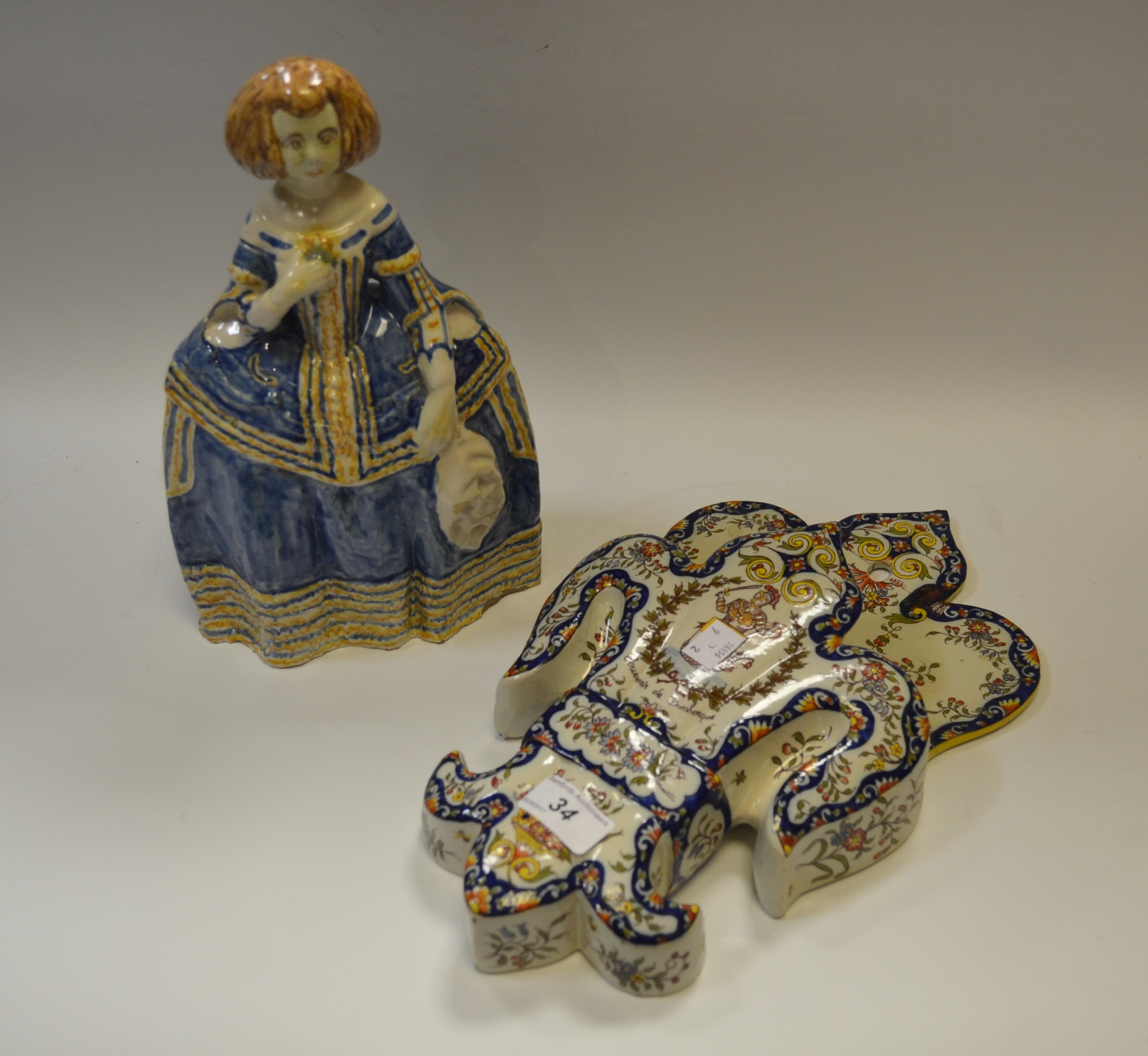 A Delft figure of a Lady carrying a Posy;