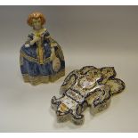 A Delft figure of a Lady carrying a Posy;