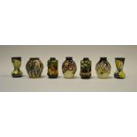 Seven contemporary Moorcroft miniature vases, tube lined with flowers and trees, 5.