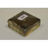 A George V silver square cigarette box,
