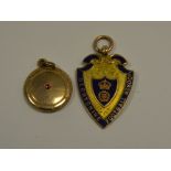 A gold Derbyshire FA medallion;