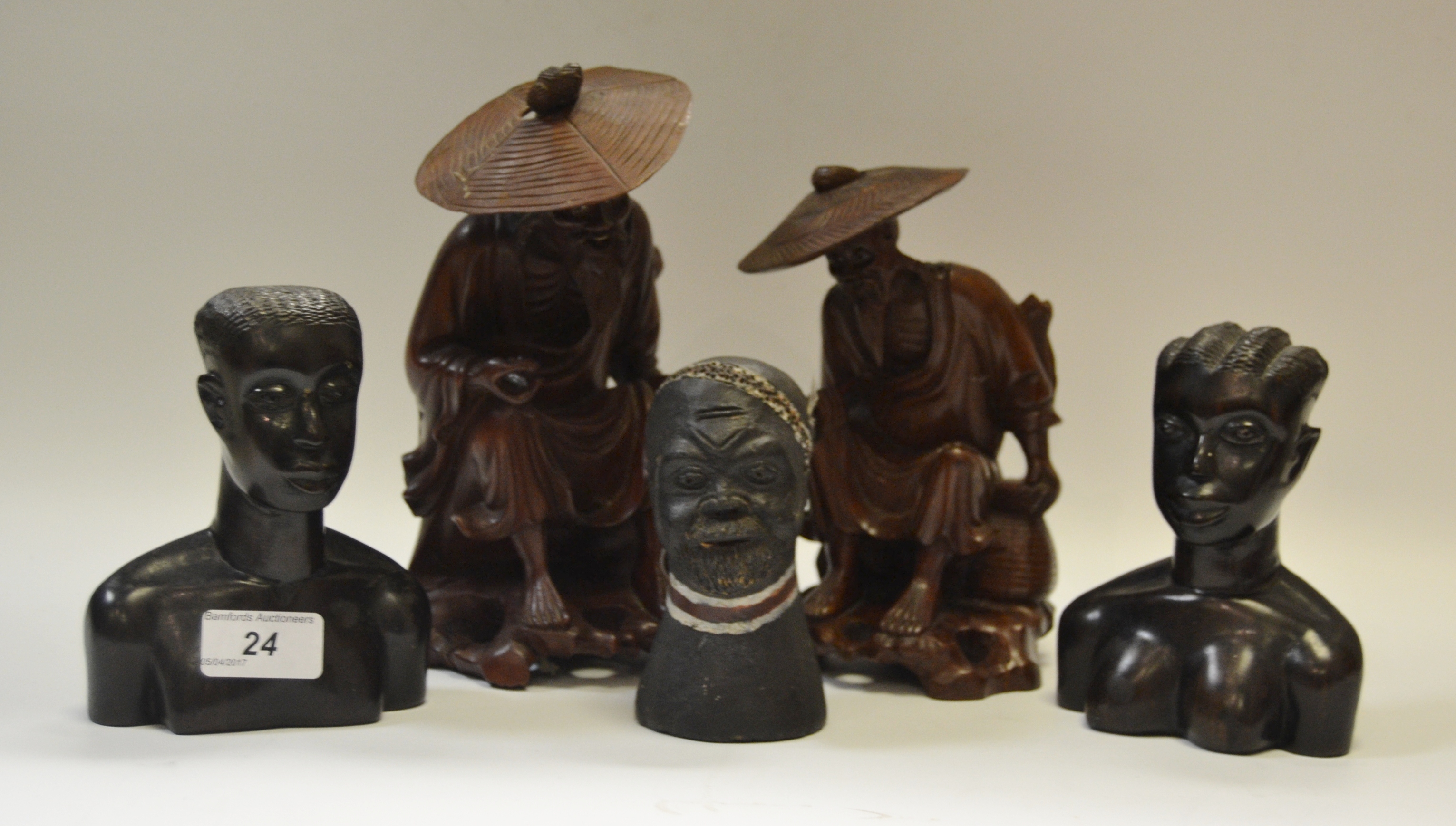 A Japanese hardwood carving, of a Fisherman, 22cm high,