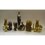 Tribal Art - an African carved head of a Tribal Elder; others; a family of brass Elephants;