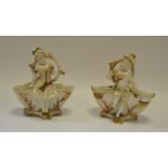 A pair of Continental porcelain figural table salts as Dandy and Beau beneath branches,