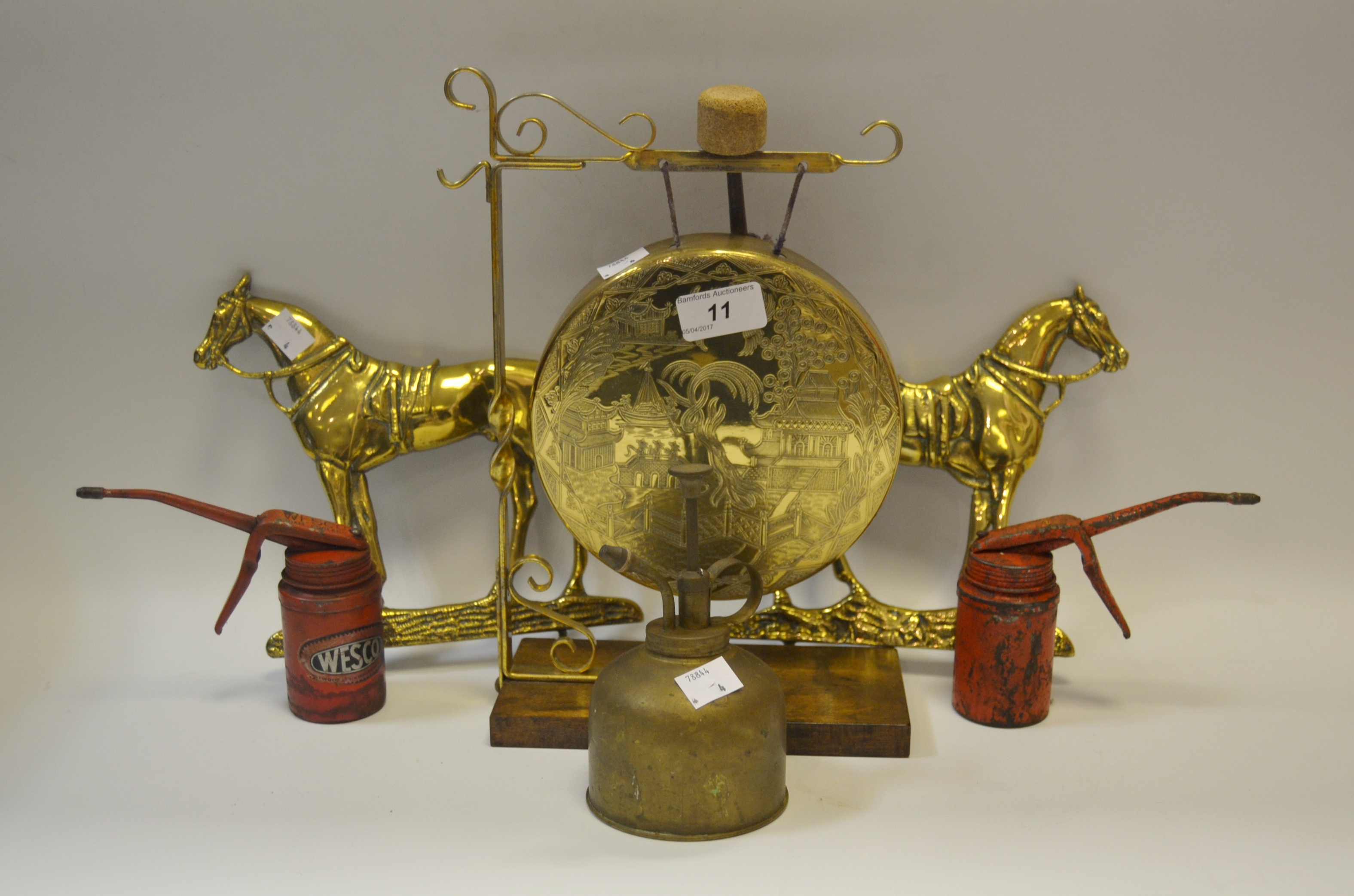 Ephemera - a brass dinner gong; a pair of brass Horse wall plaques; a Wesco oil can; another ;