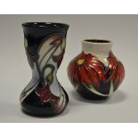 A contemporary Moorcroft ovoid vase, tube lined with large red flowerheads, 8.