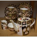 Royal Crown Derby - a 2451 pattern Imari tea service: a teapot; six cups,