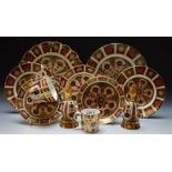 Royal Crown Derby - an 1128 imari side plate, wavy rim; another; a trio of side plates, cups,
