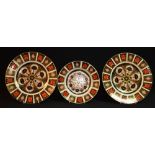 A Royal Crown Derby - a pair of 1128 pattern large dinner plates, 27vm diameter, another 21.