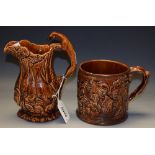 An early 19th Century frog mug, treacle glazed,