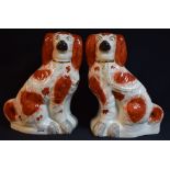 A pair of large Victorian Staffordshire chimney spaniels