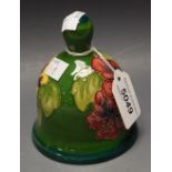 A Moorcroft pottery bell, decorated in the Hibiscus pattern, green ground, dated 1983,