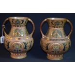 A pair of Sarreguemines art nouveau pottery twin handled vases,