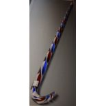 A hand made glass frigger walking stick, union jack spiraled three colour red white and blue haft,