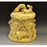 A French biscuit porcelain tobacco jar and cover , moulded with a Wild Boar hunt scene c.