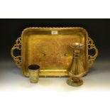 A Persian brass twin handled tray; a brass baluster shaped vase;