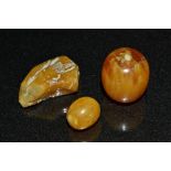 A free form amber bead, others oval, 24.