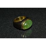 An emerald, ebony and 18ct gold dress ring, single oval cabochon emerald, approx 11.