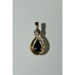 A sapphire and diamond teardrop pendant, 9ct yellow gold frame and mount, stamped 375, 21mm drop, 1.