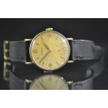 Eterna - a vintage gentleman's gold cased wristwatch, circular dial, quartered Arabic numerals,