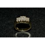 A diamond cluster ring, central quartet of princess cut square diamonds,