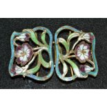 An enamelled Art Nouveau gilt metal belt buckle, open cast sinuous flowers,