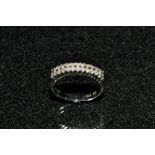 A diamond half eternity ring, set with twenty six round cut diamond in two rows of thirteen stones,