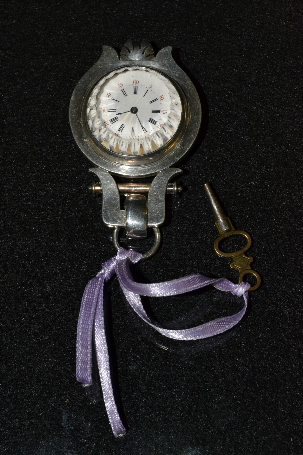An unusual Art Nouveau white metal lady's/nurse's fob watch, white dial,