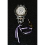 An unusual Art Nouveau white metal lady's/nurse's fob watch, white dial,