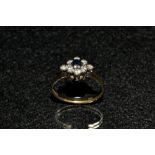 A diamond and sapphire floral cluster ring,