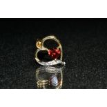 A garnet and diamond open heart pendant, 9ct yellow gold frame and mount, stamped 375, 21mm drop, 1.