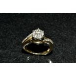 A diamond cluster ring, raised seven stone flower head,