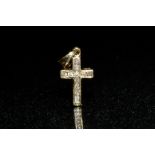 A diamond set cross pendant, inset with eleven round cut diamonds, 9ct gold frame, 12mm drop,